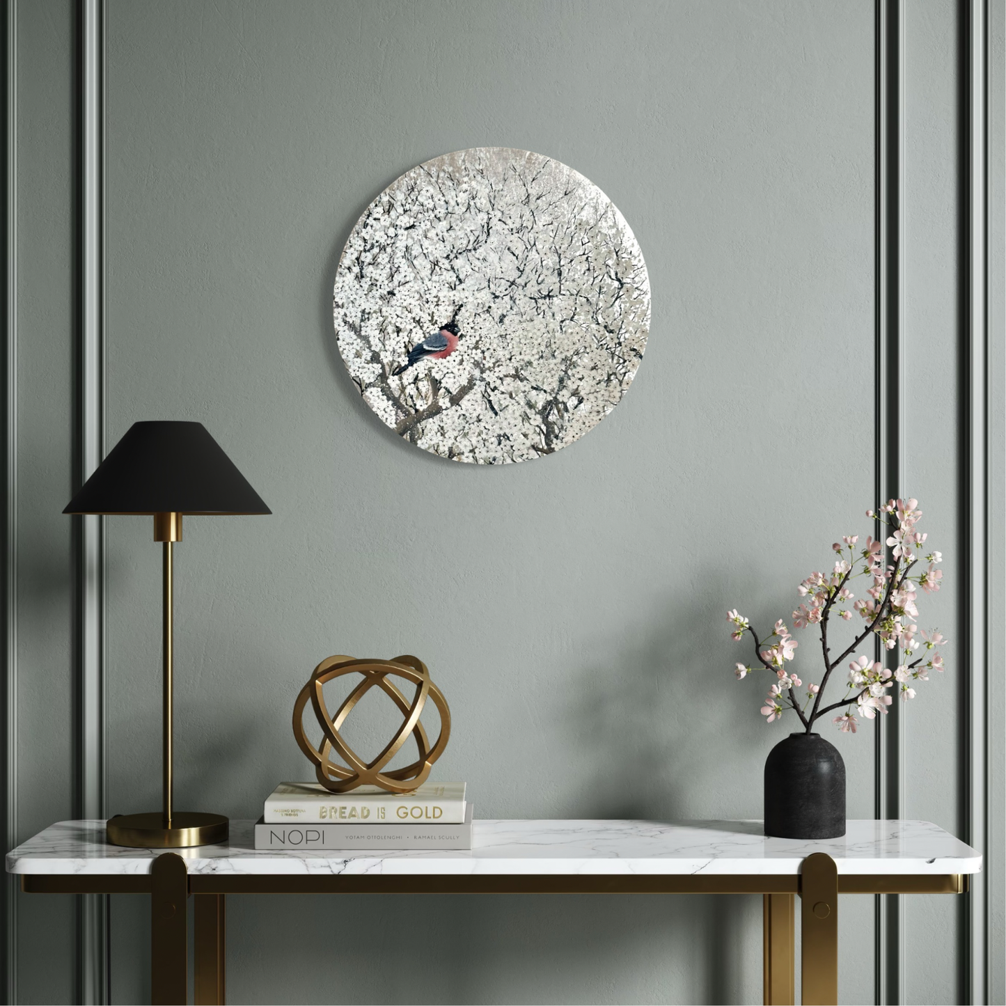 Decorative wall art with a bird design on a gray wall above a marble console table.