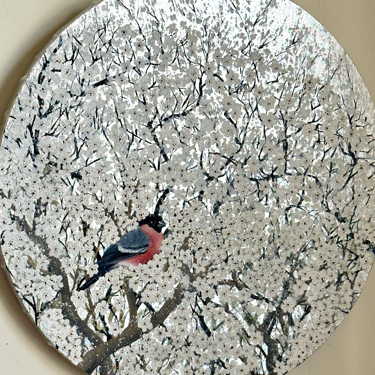 Artwork of Bird perched on a branch with white blossoms in the background
