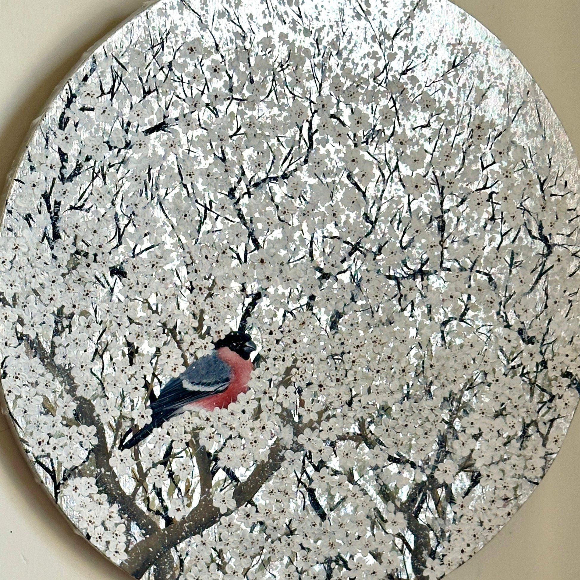 Artwork of Bird perched on a branch with white blossoms in the background