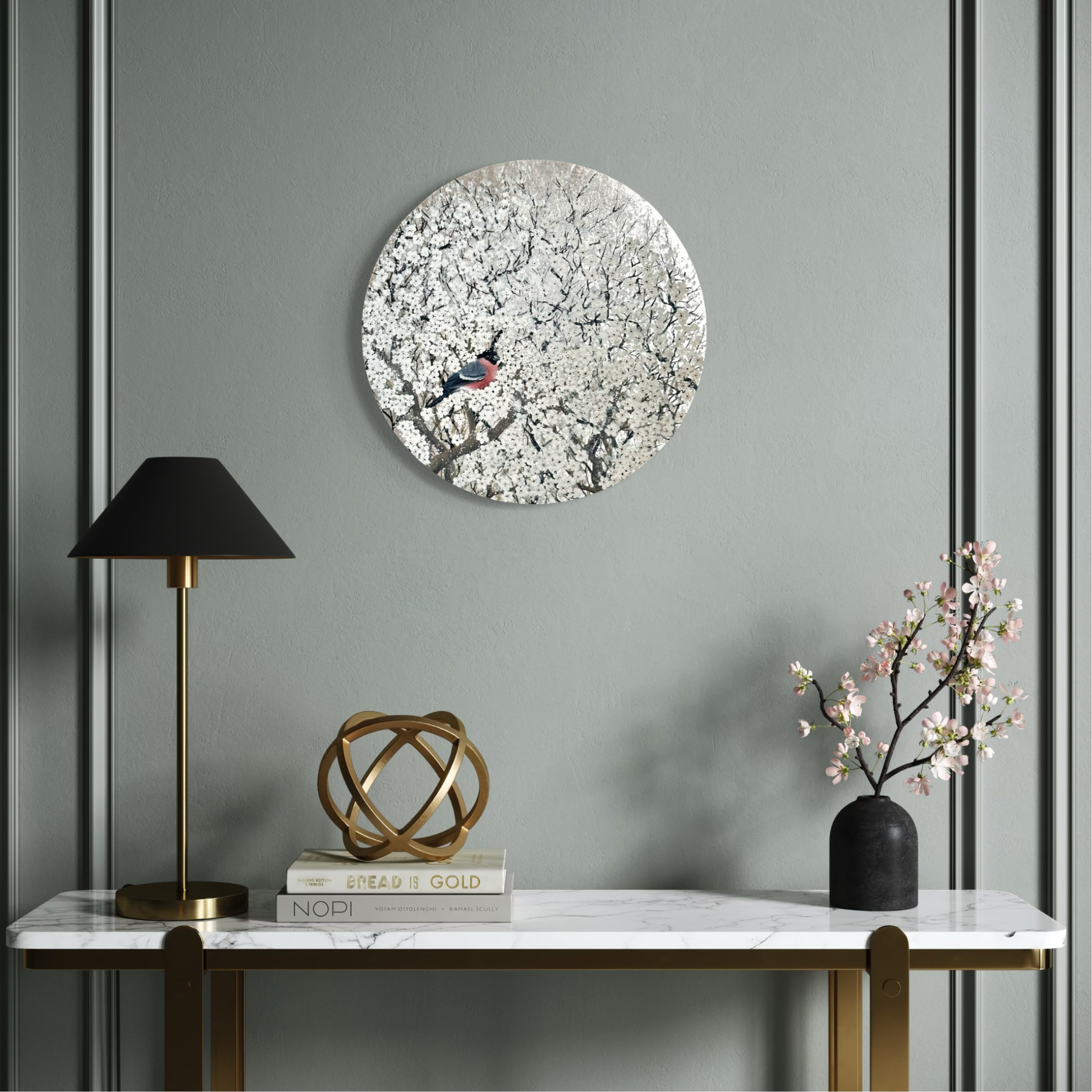 Decorative wall art with a bird design on a gray wall above a marble console table.